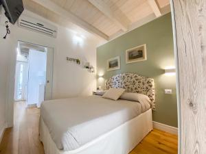 En eller flere senge i et værelse på Il Tramonto by Great Stays