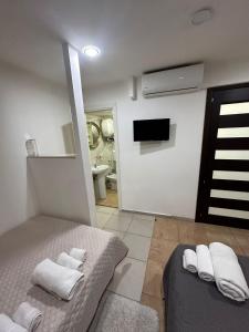 A bed or beds in a room at Holiday apartament