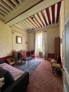 Posezení v ubytování Maison au milieu d'un parc