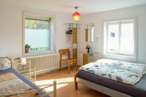 Postel nebo postele na pokoji v ubytování Helene Hohenems, 4-12 P, Haus, 4 Schlafzimmer, Küche, Parkplatz, Garten, Wifi