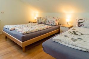Postel nebo postele na pokoji v ubytování Helene Hohenems, 4-12 P, Haus, 4 Schlafzimmer, Küche, Parkplatz, Garten, Wifi