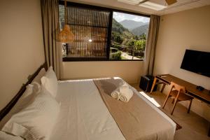 Cama ou camas em um quarto em Pousada Yamandu - Piscinas Aquecidas