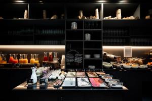 a counter with plates and vases on top at Pullman Riga Old Town in Riga