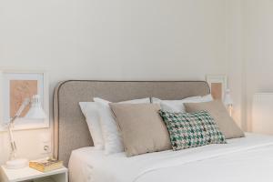 A bed or beds in a room at Tiramisu by halu! Apartments