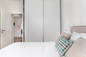 A bed or beds in a room at Tiramisu by halu! Apartments