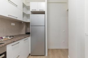 A kitchen or kitchenette at Tiramisu by halu! Apartments