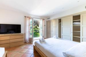 En eller flere senge i et værelse på Magnifique Villa avec piscine et hammam