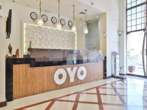 a ovo store in a building with clocks on the wall at OYO 367 Eureka Hotel in Dubai