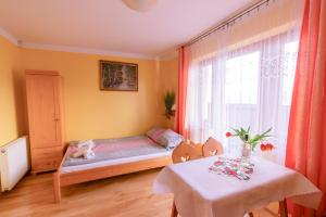 Łóżko lub łóżka w pokoju w obiekcie Willa Piękne Widoki