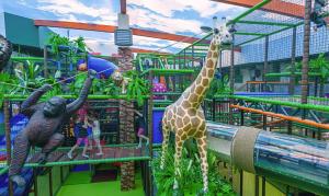 a zoo with giraffes and other animals in it at Willa Pogodna in Jarosławiec