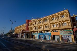 a large building on a city street with at Sand Beach Resort in Hurghada