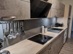 a kitchen with a sink and a counter top at diemelseeholiday Ferienwohnung im Sauerland mit Kamin in Diemelsee