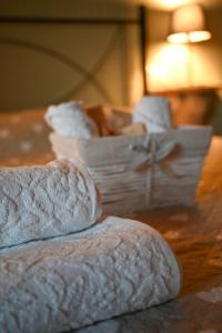 two loaves of bread sitting on a wooden table at Recinatum 1296 in Recanati