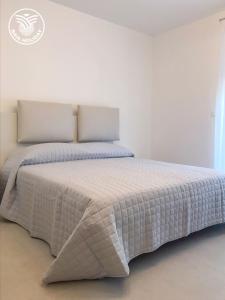 Postel nebo postele na pokoji v ubytování Appartamenti Mare Azzurro