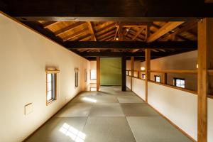 an empty hallway in a building with wooden ceilings at Kuranoyado Matsuya in Fujikawaguchiko +66 photos