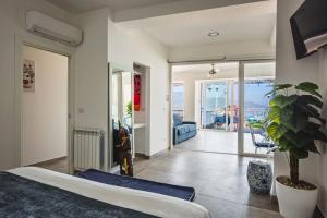 Postel nebo postele na pokoji v ubytování Dream View Suites Taormina