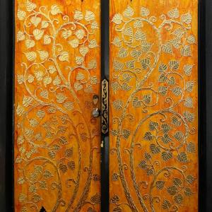 a close up of a door with a design on it at Bee Friend Boutique Guesthouse in Chiang Mai