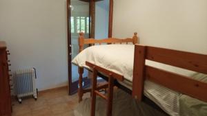 a bedroom with a bunk bed and a mirror at Marina in Lleida