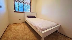Llit o llits en una habitació de Greenhill Rockhampton