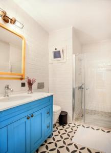 a bathroom with a blue sink and a shower at Petite Boutique Hotel in Ildır +8 photos