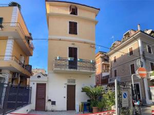 two different views of a building in a city at Suite Balilla 5 centralissima a due passi dal mare in San Benedetto del Tronto