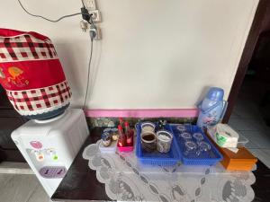 a toy kitchen with a toy stove and a mixer at EL Homestay Bunaken in Bunaken