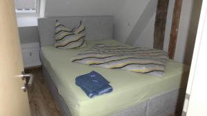 a bed in a room with at Stuifenblick in Waldstetten