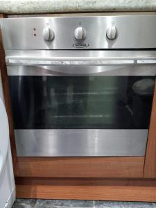 a stainless steel oven sitting in a kitchen at Jasmine Haus in Moortown