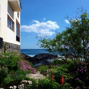 a view of the ocean from a building at Hotel Orpheus in Giardini Naxos