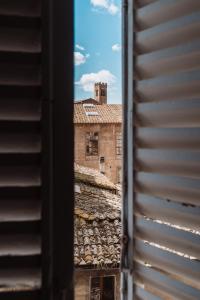 a view of a building from a window at BirBo Bike Hospitality in Siena