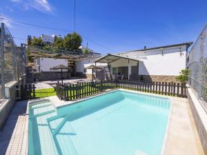 a swimming pool in the backyard of a house at Cubo's Casa Rural Maylu in Villafranco de Guadalhorce