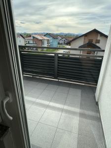 a balcony with a view of a city at XL Apartman in Teslić