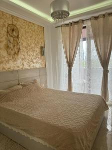 Ένα ή περισσότερα κρεβάτια σε δωμάτιο στο My home-Alexandra-Unique Luxury