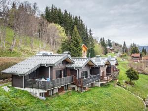 a row of log homes on a hill at Chalet Les Gets, 2 pièces, 6 personnes - FR-1-671-139 in Les Gets