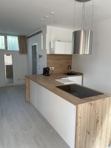 a kitchen with a counter top with a sink at Esmeralda in Palma de Mallorca