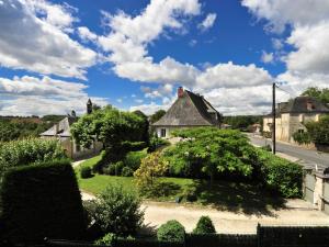 a view of a house with trees and bushes at Auberge d'ici et d'ailleurs in Cressensac +6 photos
