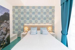 Postel nebo postele na pokoji v ubytování Hotel Miramare