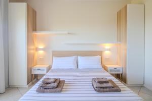 Un pat sau paturi într-o cameră la Attico Bella vista