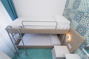 Postel nebo postele na pokoji v ubytování Hotel Miramare