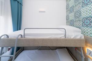 Postel nebo postele na pokoji v ubytování Hotel Miramare
