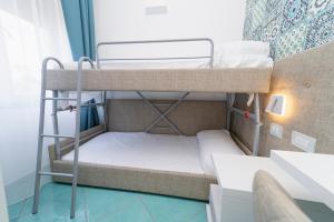 Postel nebo postele na pokoji v ubytování Hotel Miramare