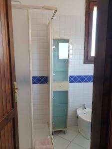 a bathroom with a shower and a sink at Le Residenze di Stintino La Pelosa in Stintino