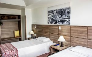 Cama ou camas em um quarto em Hotel Dan Inn Planalto São Paulo