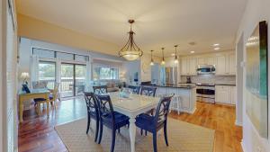 a kitchen and dining room with a table and chairs at 284 Turnberry Village in Hilton Head Island
