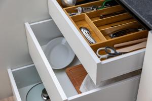 a drawer in a bathroom cabinet with a sink at Piazza del Lago Suites - Menaggio in Menaggio +39 photos