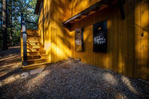 a building with a sign on the side of it at Enchanting Escape for Two in Broken Bow