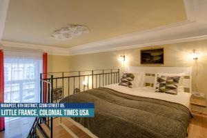 Postel nebo postele na pokoji v ubytování Little Americas USA Colonial Times Apartments + 37 fotografií