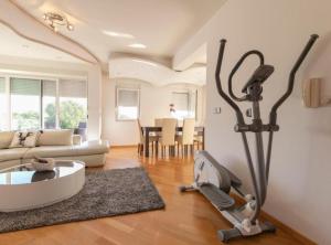 a living room with a treadmill and a living room at M & B in Bibinje