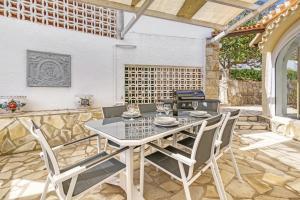 a dining room with a table and chairs at Adriana in Denia