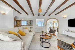 a living room with a couch and a table at Adriana in Denia
